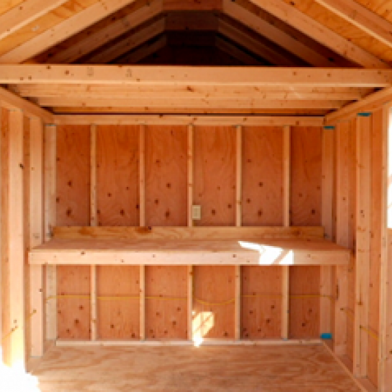 Garden style shed with workbench added